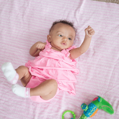 Show me milestones for a 4-month-old baby.